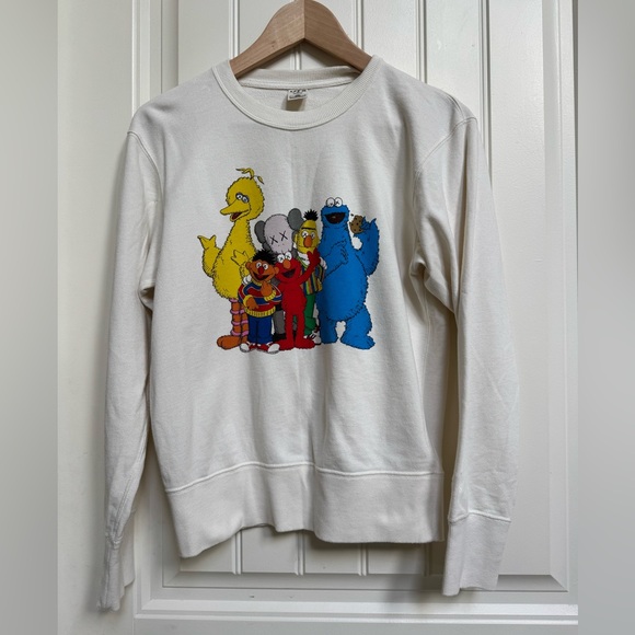 Uniqlo x KAWS Tops - Uniqlo x Kaws Sesame Street Unisex Cream Crewneck Sweatshirt. Size XS